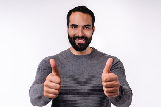 Handsome Islamic Man In Mid 20s Showing Thumbs Up Isolated Over White Background