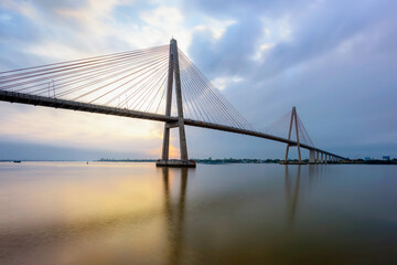 Rach Mieu cable-stayed bridge over Mekong River in sunrise, Tien Giang province, Vietnam.	
