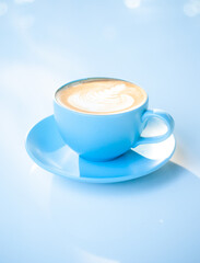 Beautiful latte coffee cup on white table