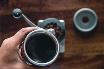 hand holding a cup of coffee