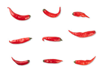 Group of red chili pepper, various positions, isolated over white background
