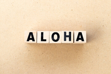 Alphabet letter block in word aloha on wood background © bankrx