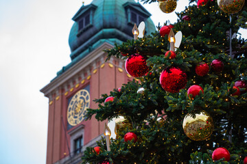Huge Christmas balls against the background of the castle tower