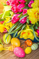 spring flowers with easter eggs