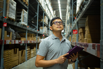 Worker warehouse during check stock product in storehouse. 