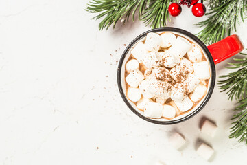 Hot chocolate with marshmallow at white table. Top view with copy space.