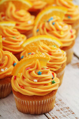 Cupcakes with orange icing on top	