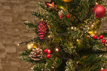 Fototapeta na wymiar Christmas tree with decorations near with lights