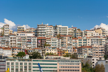 Fototapeta premium Cityscape of Golden horn with ancient and modern buildings in Istanbul Turkey from the Bosphorus strait on a sunny day with background cloudy sky