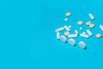 close up. various tablets on a blue background.