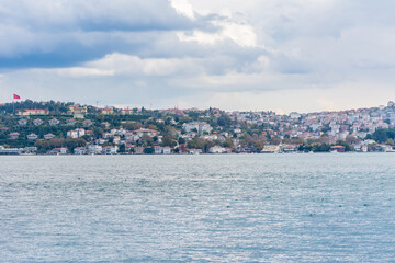 Obraz premium Cityscape of Golden horn with ancient and modern buildings in Istanbul Turkey from the Bosphorus strait on a sunny day with background cloudy sky