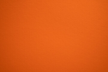 Orange color wall texture background. Carrot color texture backdrop design. Amber, pumpkin,...