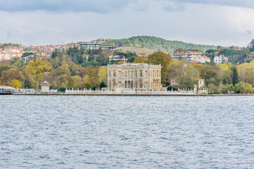 Obraz premium Goksu Palace (Littlewater Pavilion, Kucuksu Kasri) at the bank of the Bosphorus strait in Istanbul Turkey from ferry on a sunny day with background cloudy sky