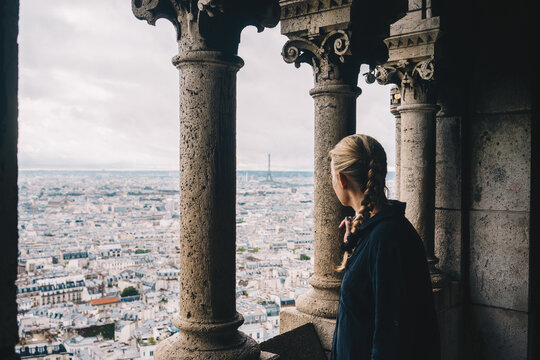 Woman overlooking Paris from above