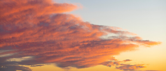 Deeply purple clouds on sunset background
