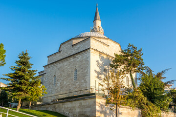 Fototapeta premium Firuz Agha Mosque with single minaret at the corner of Sultanahmet Square against blue sky in autumn, a 15th-century Ottoman mosque in the Fatih district