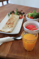orange juice and taco ,vegetable roll or salad roll