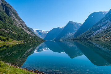Fototapeta premium Mountain reflection on a lake in Norway at Sogndal Fjord.
