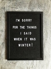 Black letterboard with text: I'm sorry for the things I said when it was winter!