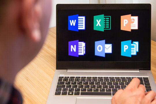 Microsoft office is used by a man on the laptop. Microsoft customer used computer software. New product is tested by IT specialist. San Francisco, February 2020.