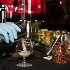 Bartender making fancy pineapple drink 