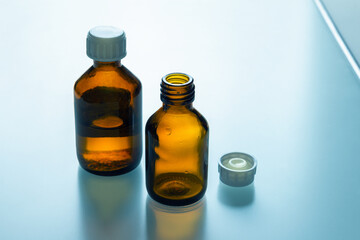 Medical bottles on glass table
