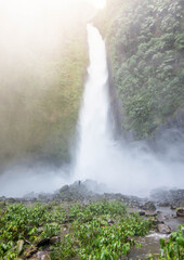 girl enjoying waterfall paradise in costa rica