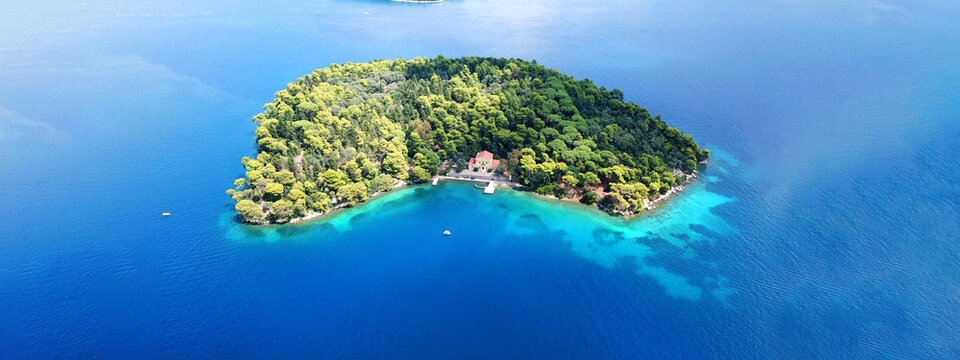 Aerial drone ultra wide photo of small island of Madouri, Lefkada island, Ionian, Greece