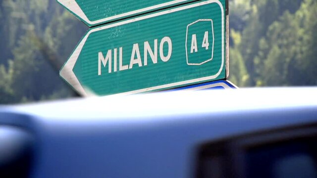 Road sign for Milano (Milan) and Courmayeur filmed in slow motion with mountains parlayed in background. 

1080P 200FPS 10 bit SLOG2-REC709