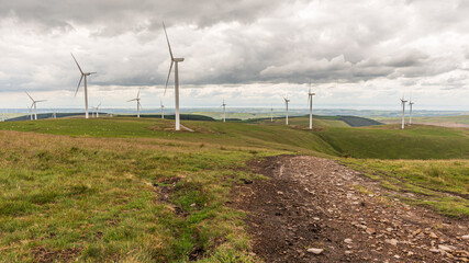 An extensive wind farm, atop a mountain in south Wales, UK, generating power for the surrounding area