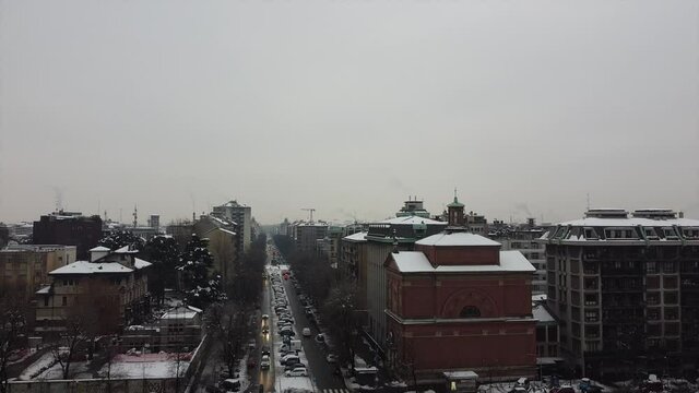 ITALY, MILAN 12-29-2020, drone aerial view of Il Dritto The Straight One, Generali Lo Storto The Twisted One, PwC Il Curvo The Curved On in citylife district  shopping area with snow