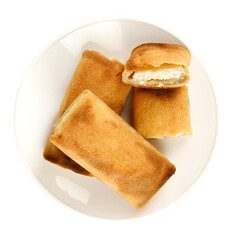Pancakes stuffed with cottage cheese on a white plate