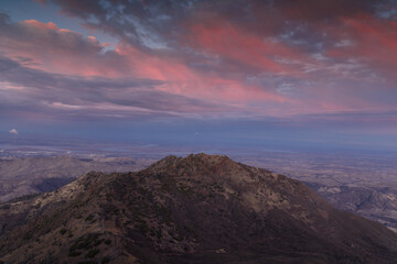 Twilight Sky over North Peak via Main Peak. In the background is Antioch on the left, and Brentwood to the right. Mt Diablo State Park, Contra Costa County, California, USA.
