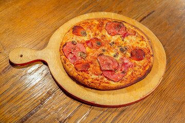 Textured surface of cheese pizza with spices. Homemade fresh baking recipe