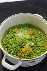 Cooking Green Peas in the pot on the stove