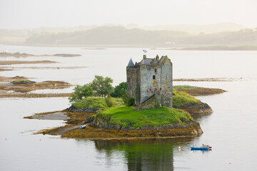 Stalker Castle, a four storey tower house or keep picturesquely set on a tidal islet on Loch Laich, Port Appin, Argyll, Scotland.