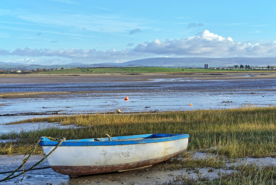 A rowing boat on the shore at Sunderland Point - Powered by Adobe