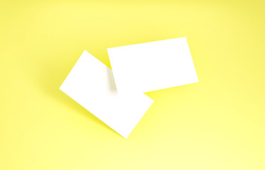 Floating Business Card Mockup. Closeup on two empty business cards floating in the air in front of the background.