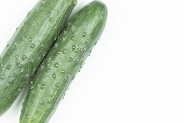 Whole fresh cucumbers isolated above white background
