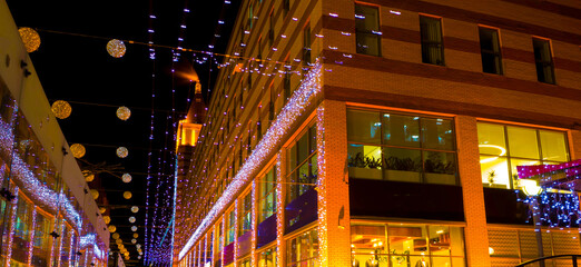 Dark city street with bright round illumination