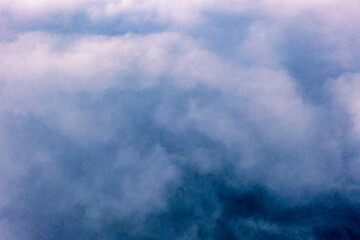 Obraz premium Dramatic aerial view of clouds from above at the Slieve League cliffs in County Donegal, Ireland