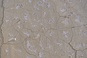 cracked concrete wall covered with gray cement surface as background