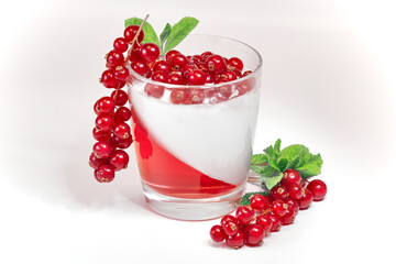 White delicious yogurt dessert with red currant berries and raspberry jelly. Healthy Breakfast, light snack. The concept of healthy eating.