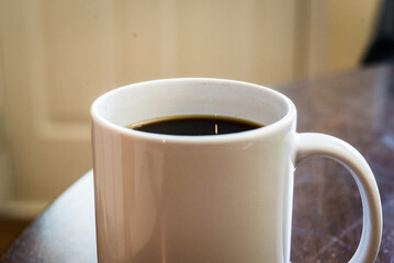 cup of coffee on wooden table