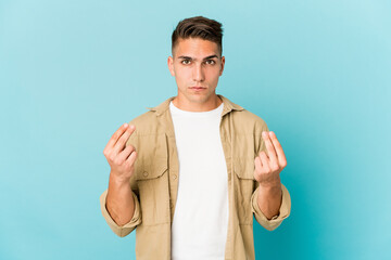 Young caucasian handsome man isolated showing that she has no money.
