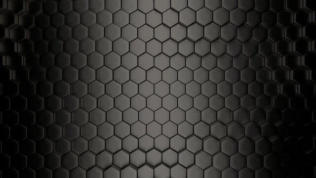 A screensaver of black metal hexagons moves and reflects light.