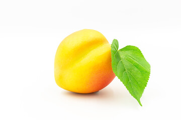 Peach with green leaf isolated on white background