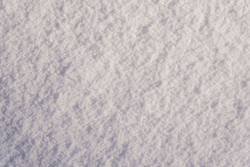 Fototapeta premium Snow texture as winter background. Smooth surface of clean fresh snow. Snow patterns.