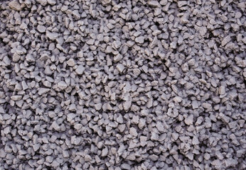 Small stones under the snow as background.