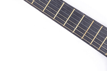 Guitar neck with frets above white background